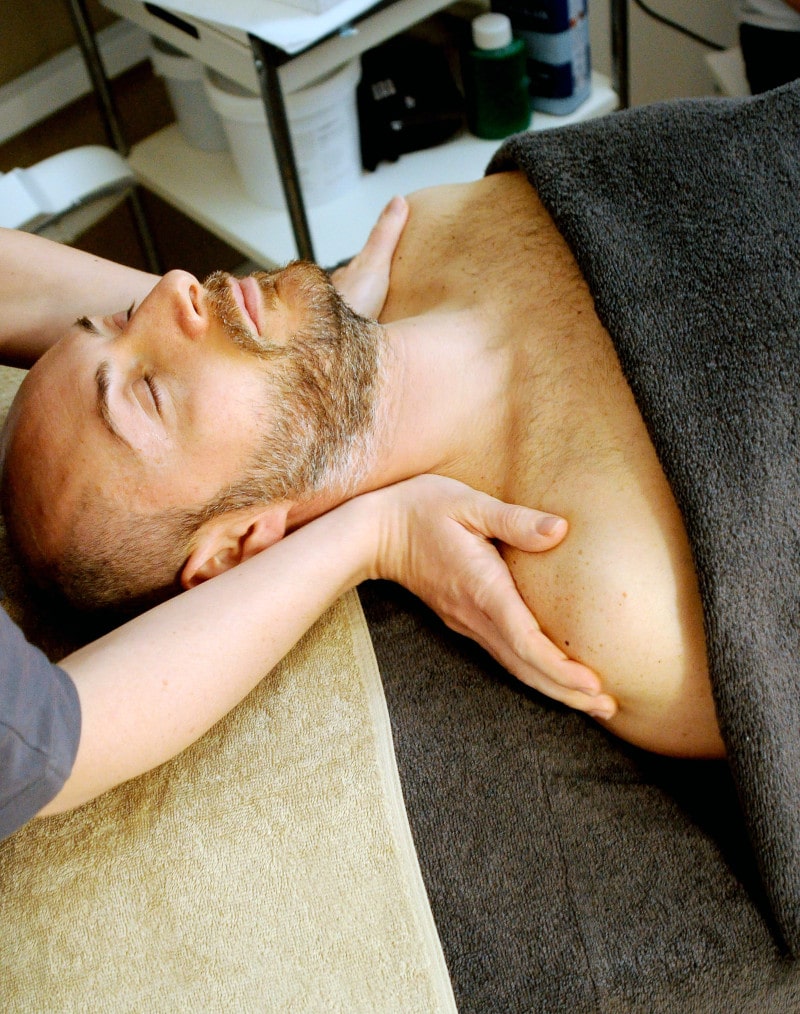 man getting a massage after going from a Denver dispensary